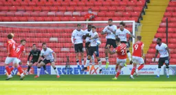 Jump to it. A defensive wall attepmpt to block Alex Mowatt`s free kick