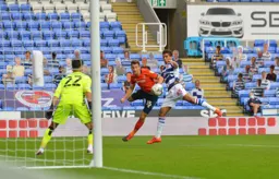 Tom Lockyer sends a header back across the goal