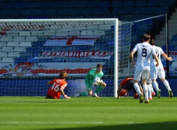 Simon Sluga goes to his knees to safely gather the ball