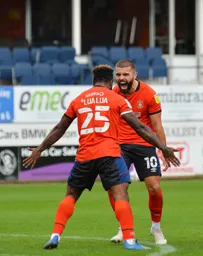 Elliot Lee celebrates his goal with Kazenga LuaLua