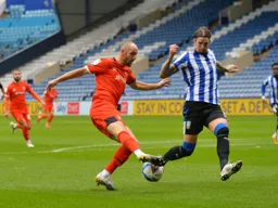 Danny Hylton`s drag back sends Joost Van Aken in the wrong direction