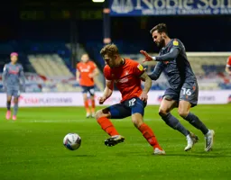 James Collins shields the ball away from Carl Jenkinson