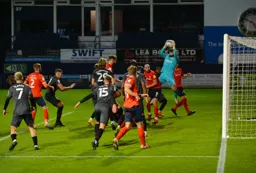 Danny Hylton can only watch as David Raya makes a safe catch