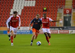George Moncur bursts through between defenders
