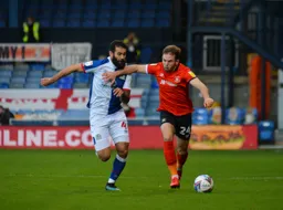 Jordan Clark gets away from Bradley Johnson
