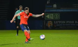 James Collins scores the third goal from the penalty spot