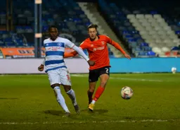 Harry Cornick in a race for the ball with Bright Osayi-Samuel