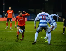 The ball is cleared before Harry Cornick can block it