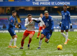 Harry Cornick and Emerson dos Santos grapple for the ball