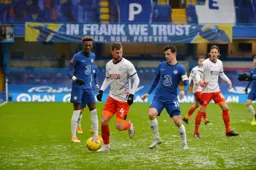 Ryan Tunnicliffe takes the ball past Mason Mount