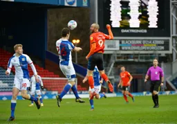 Darragh Lenihan heads the ball away from Danny Hylton