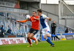 Harry Cornick is closed down by Darragh Lenihan