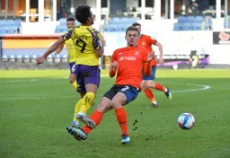 Kiernan Dewsbury-Hall and Duane Holmes compete for the ball