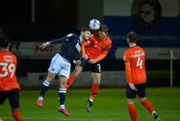 Martin Craine bravely goes in for a header