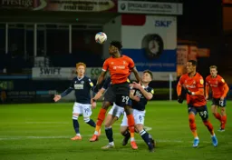 Elijah Adebayo heads the ball forward