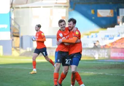 Kiernan Dewsbury-Hall celebrates Town`s equaliser with goal scorer Ryan Tunnicliffe