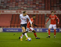Harry Cornick makes a side foot pass