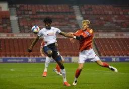 Elijah Adebayo holds off Joe Worrall`s challenge