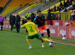 Dan Potts finds Max Aarons blocking his progress