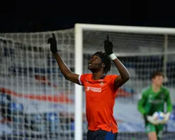Elijah Adebayo looks to the heavens after scoring the second goal from the penalty spot