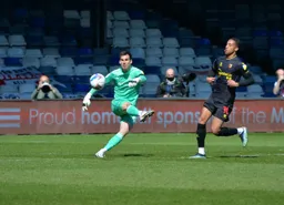 Simon Sluga appears to slice his clearance