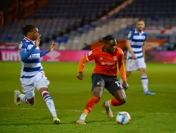 Pelly-Ruddock Mpanzu is closed down in midfield