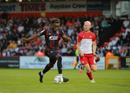 Admiral Muskwe driving forward with the ball