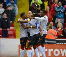 Players celebrate Amari'i Bell putting the Hatters ahead