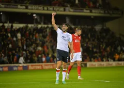 Harry Cornick salutes the travelling fans