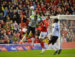 Elijah Adebayo challenging the keeper