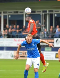 Elijah Adebayo puts in an aerial challenge that Mick Harford would be proud of