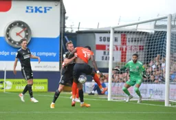 Elijah Adebayo going for goal, but the ball gets caught under his feet