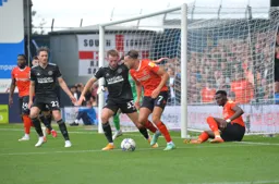 Harry Cornick trying to recycle the ball back into the box against former Hatter Rhys Norrington-Davies