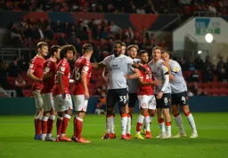 The Town players queue up ready for a ball to be sent into the box from a corner