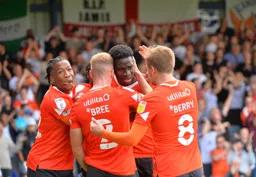 Players celebrating with Elijah Adebayo
