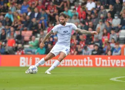 Henri Lansbury spraying out a big diagonal ball