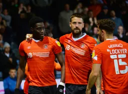 Elijah Adebayo gets approval from his captain Sonny Bradley and his future captain Tom Lockyer