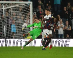 Simon Sluga clearing the ball under pressure