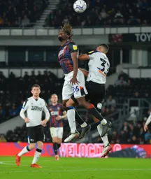 Admiral Muskwe challenging with former Hatter Curtis Davies