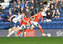 Jordan Clark charging forward with the ball from midfield