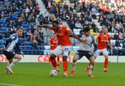 Cameron Jerome holding up the ball