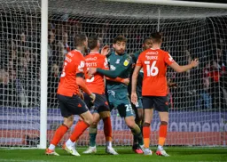 Tight marking from Matt Crooks on from a Luton Town corner