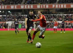 Allan Campbell battling to win the ball back