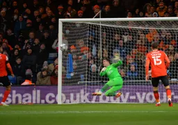 Simon Sluga makes the save