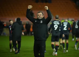 Nathan Jones celebrating in front of the travelling Hatters