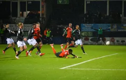 Elijah Adebayo with a diving header to score