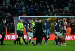 Nathan Jones consolling the players after a tough match