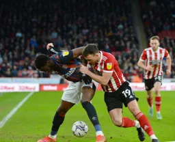 Elijah Adebayo holds onto the ball