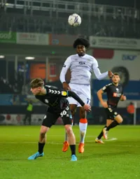 Pelly-Ruddock Mpanzu wins the aerial ball