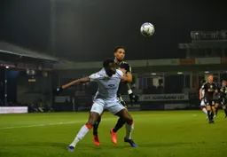 Elijah Adebayo holds off a challege